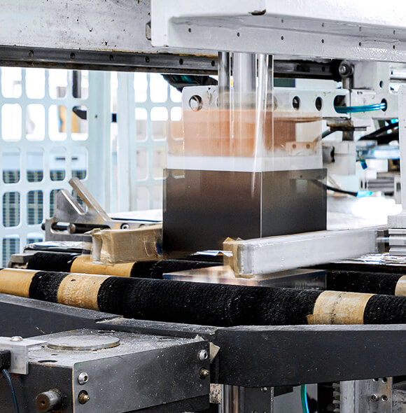 a black box is being folded by the auto folding machine